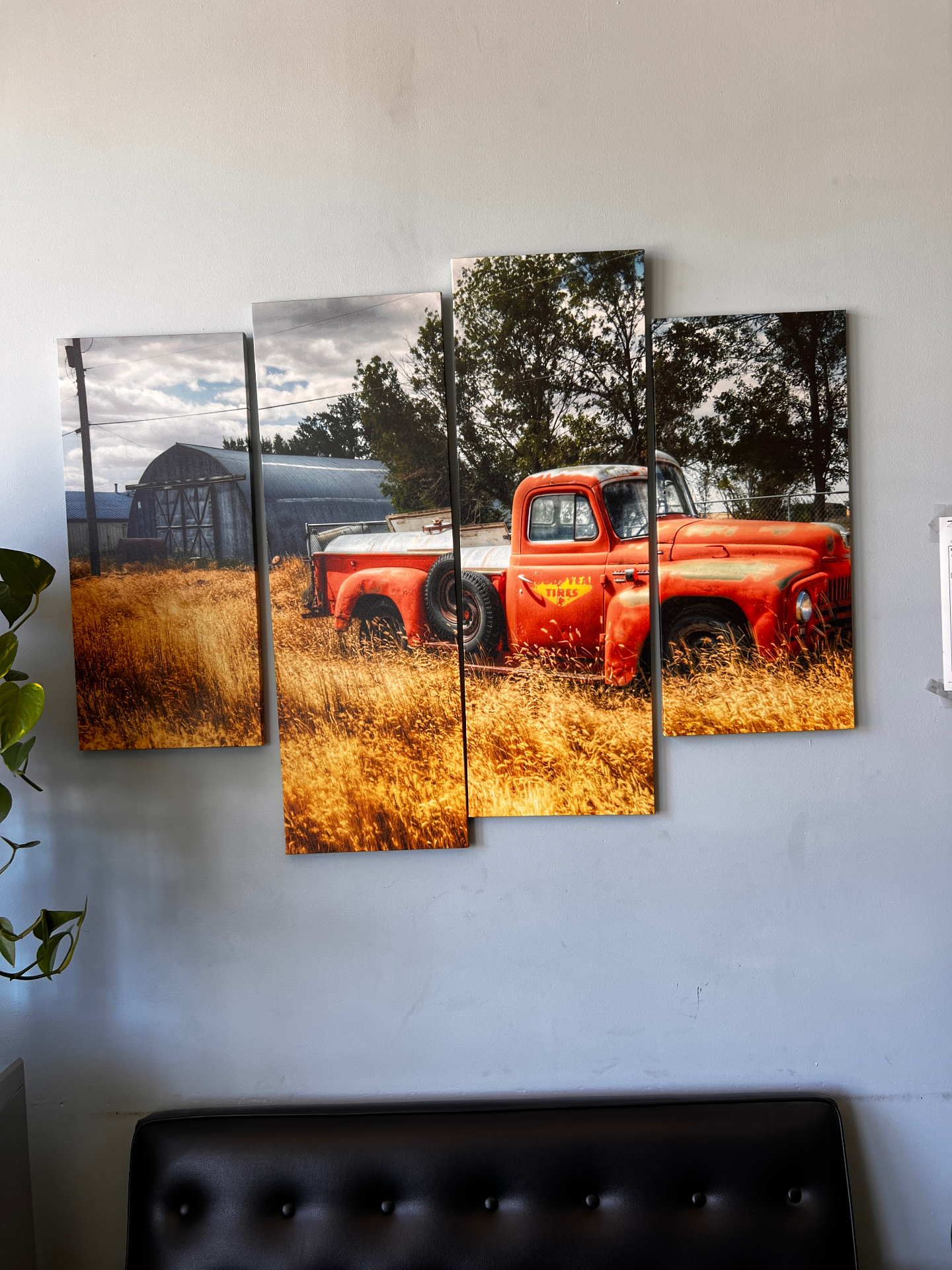 Vintage red pickup truck canvas wall art in the shop office
